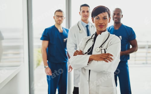Preview: Black female standing in front of team