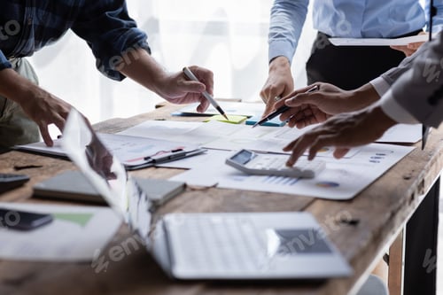 Preview: Group of confident business people point to graphs and charts to analyze market data, balance sheet,