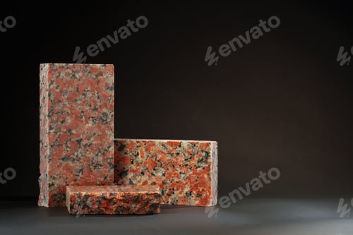 Preview: Pieces of granite stone on black background studio shot