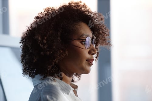 Preview: Black Female Speaker Giving Presentation at Business Conference