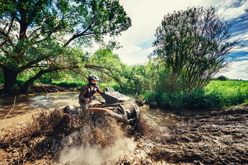 Preview: Man on the ATV Quad Bike running in mud track