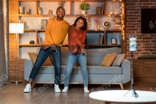 Preview: Happy black lovers having fun at home, recording video