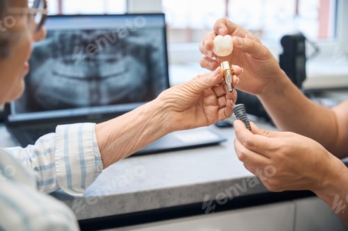 Preview: Prosthetist consults an elderly lady in a dental clinic