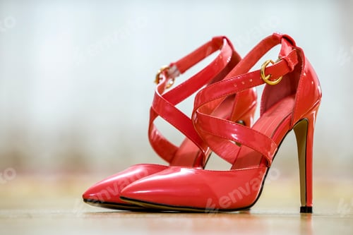 Preview: Pair of fashionable high heel leather red cut-out female shoes with golden buckles