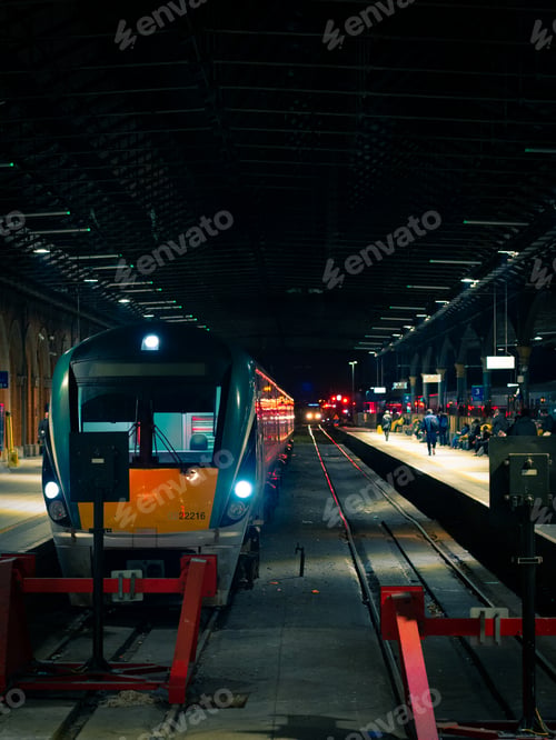 Preview: Beautiful shot of a modern train inside a Sligo Railway station in Ireland at night with lights