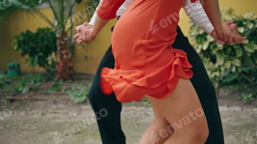 Preview: Young street dancers moving seductively in town park. View energetic woman hips