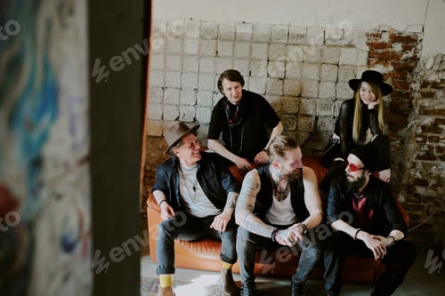 Preview: Modern Rock Band Sitting On Couch