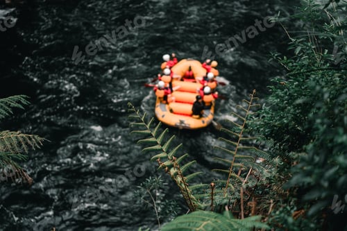 Preview: Large inflatable boat with seven people on board rowing on the violent river with a lot of current