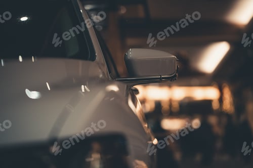 Preview: Extreme closeup shot of a white car mirror