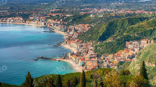 Preview: Aquamarine blue waters of sea near Taormina resorts and Etna volcano mount
