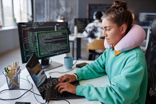 Preview: Developer working with security codes on laptop