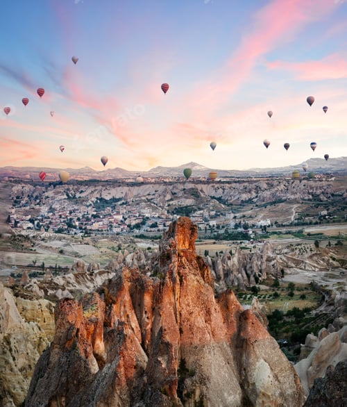 Preview: Balloons over rocks of Cappadocia in early morning