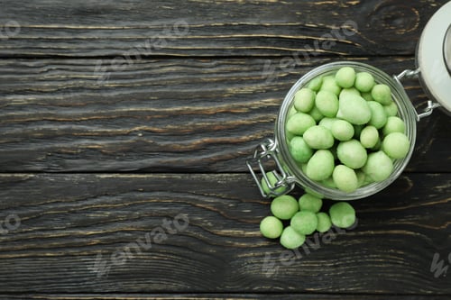 Preview: Glass jar with wasabi nuts on rustic wooden background
