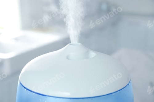 Preview: Modern air humidifier at home, closeup view