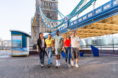 Preview: Multiracial group of happy young friends bonding in London