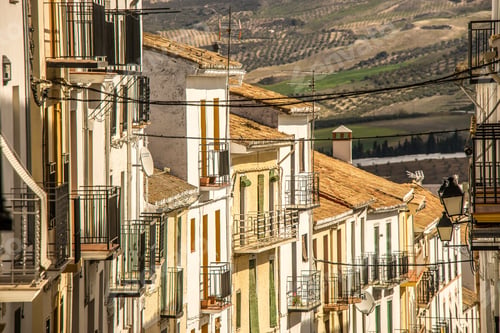 Preview: Wide shot of a street with similar looking houses on a hot day