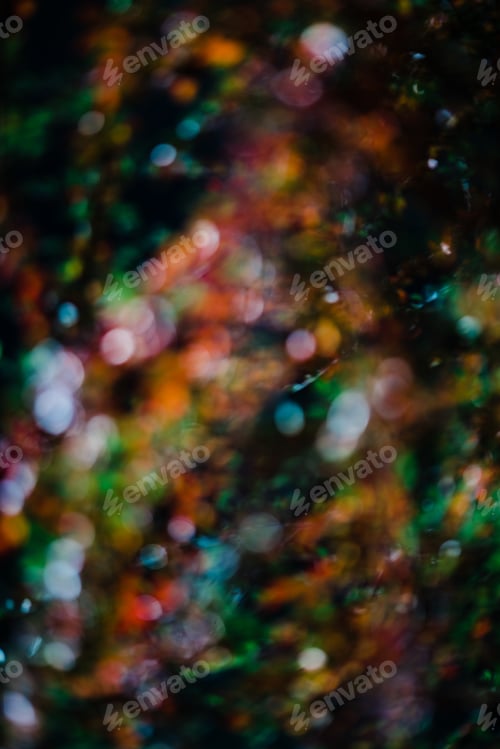 Vista previa: Blurred colorful light shining in dark