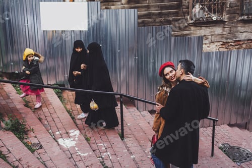 Preview: European couple walking at old istanbul streets in Balat. local women are veiled in paranja