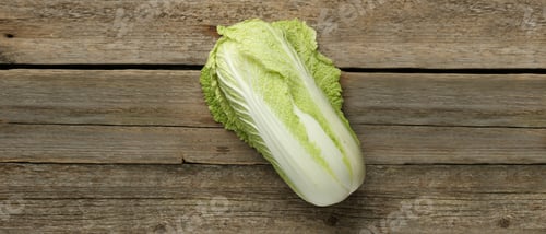 Preview: Fresh ripe Chinese cabbage on wooden table, top view. Banner design