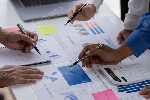 Preview: Group of confident business people point to graphs and charts to analyze market data, balance sheet,
