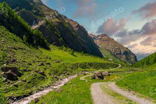 Preview: Beautiful mountain landscapes in Val Troncea on a cloudy sunsetsky background