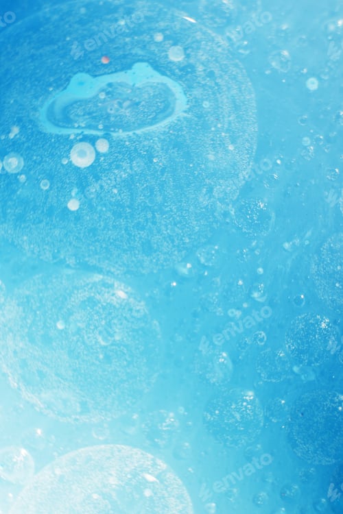 Preview: Oil bubbles close up. circles of water macro. abstract light blue background