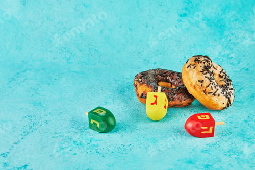 Preview: Happy Hanukkah and Hanukkah Sameach - traditional Jewish donuts, spinning tops on blue background