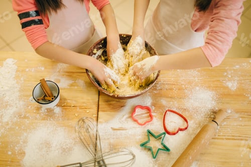 Preview: Two little girls chefs crumple the dough