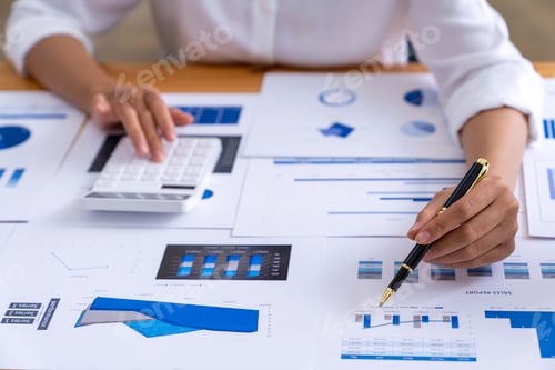 Preview: businesswoman working on desk office with using a calculator to calculate the numbers, calculating m