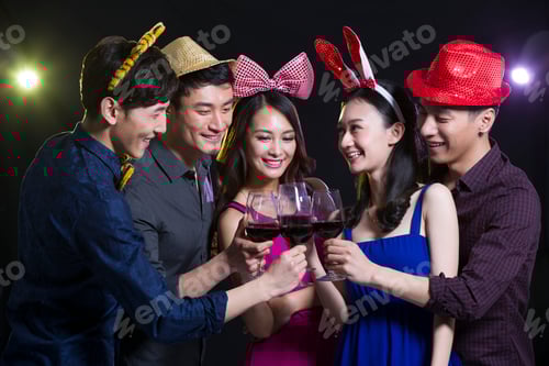 Preview: Fashionable adults toasting in party