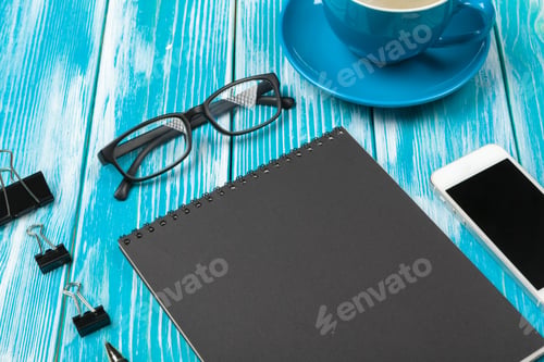 Preview: Modern workplace with cup of coffee on wooden table