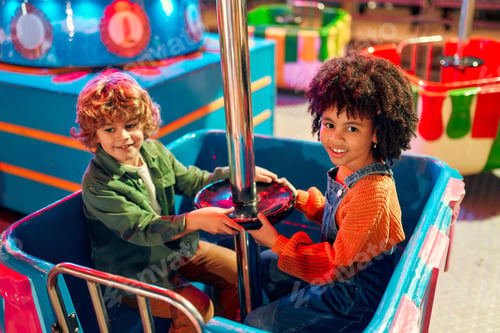 Preview: Kids having fun on a carnival Carousel