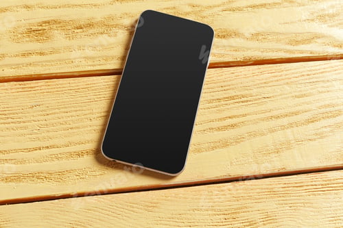 Preview: Smartphone on wooden background. Top view