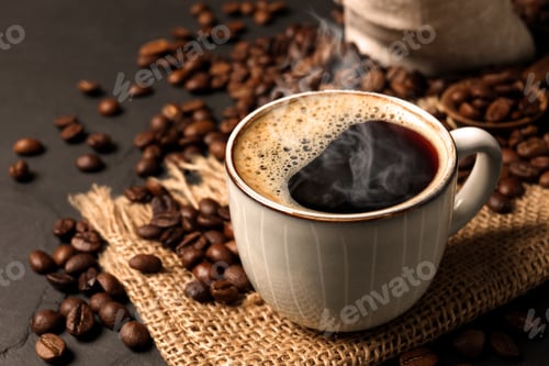 Preview: Cup of aromatic hot coffee and beans on black table, closeup
