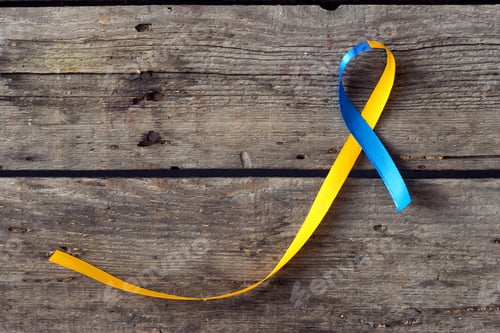 Preview: Down Syndrome Day blue and yellow ribbon on wooden background