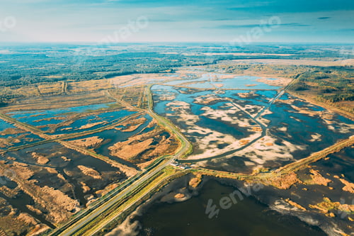 Preview: Belarus. Aerial View Of Road Through Ponds In Autumn Landscape. Ponds Of Fisheries In The South Of