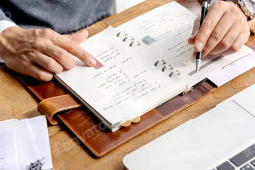Preview: Business Man Hands Schedule Notebook Concept