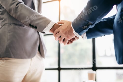 Preview: Two men shake hands in a business meeting
