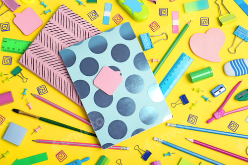 Preview: Flat lay composition with different school stationery on color background