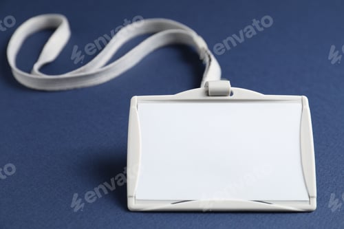Preview: Blank badge with string on blue background, closeup