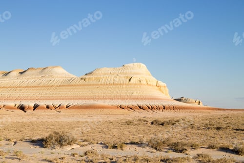 Preview: Desert landscape with layered rock formations.