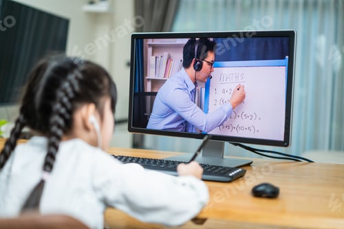 Preview: Homeschool Asian little young girl learning online class from school teacher by digital remote