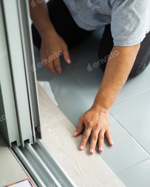 Preview: Vinyl floor installation, worker, DIY at home.