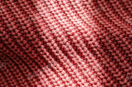 Preview: Knitted texture of a pink sweater or scarf close-up.