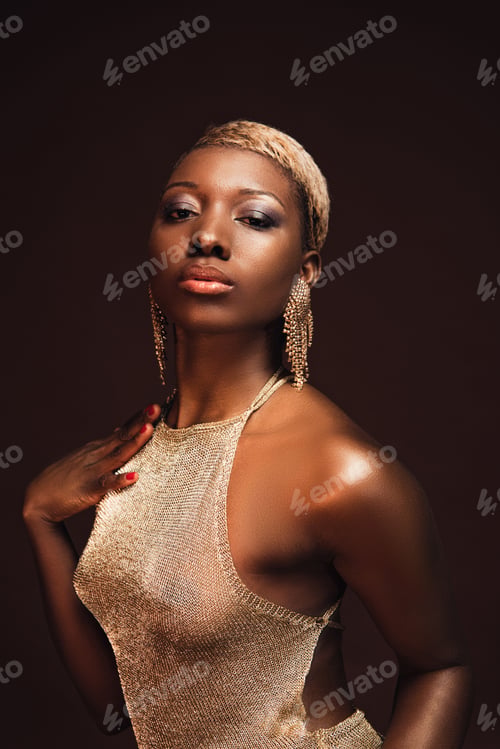 Preview: attractive glamorous african american woman with short hair isolated on brown