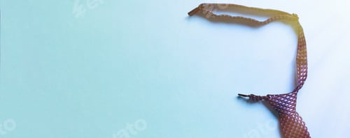 Preview: men's blue tie on a colored paper background with copy space for your text