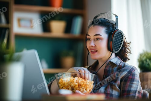 Preview: Woman Enjoying Movie Night at Home with Headphones and Popcorn, Streaming Entertainment Lifestyle