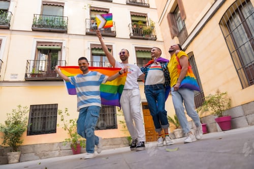 Preview: Homosexual male friends jumping for joy at gay pride party, diversity of young people in the city, r
