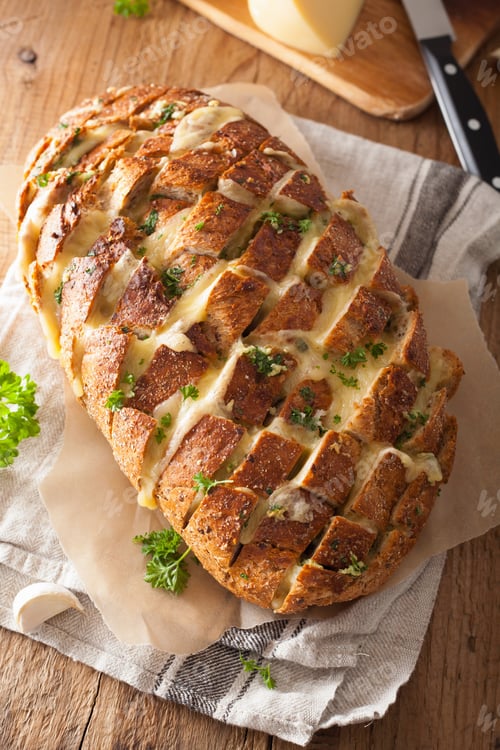 Preview: baked party bread with melted cheese butter herbs