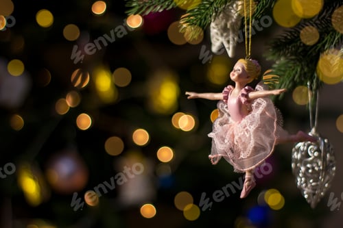 Preview: Ballerina toy figurine on Christmas tree. Holiday background.